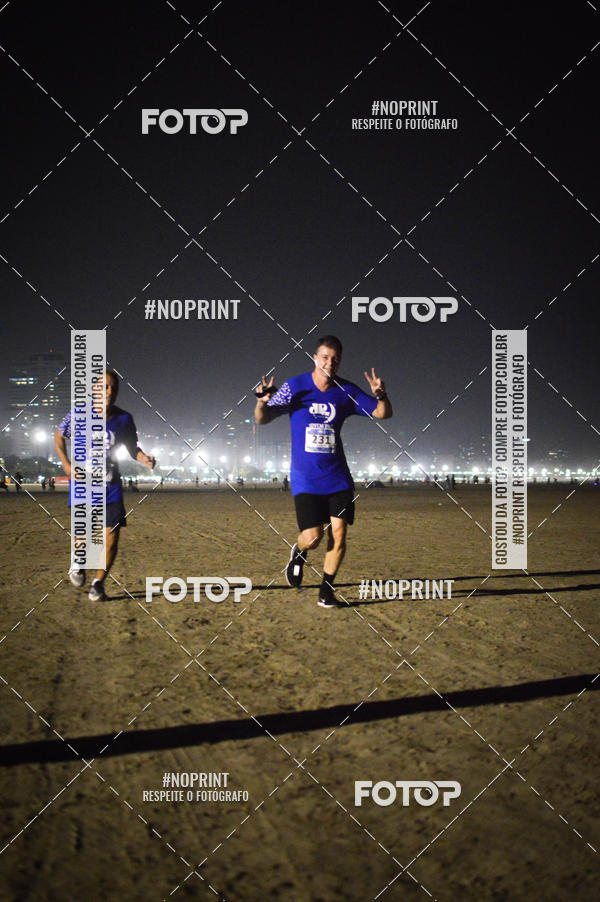 Buy your photos of the eventJovem Pan Night Run Santos on Fotop