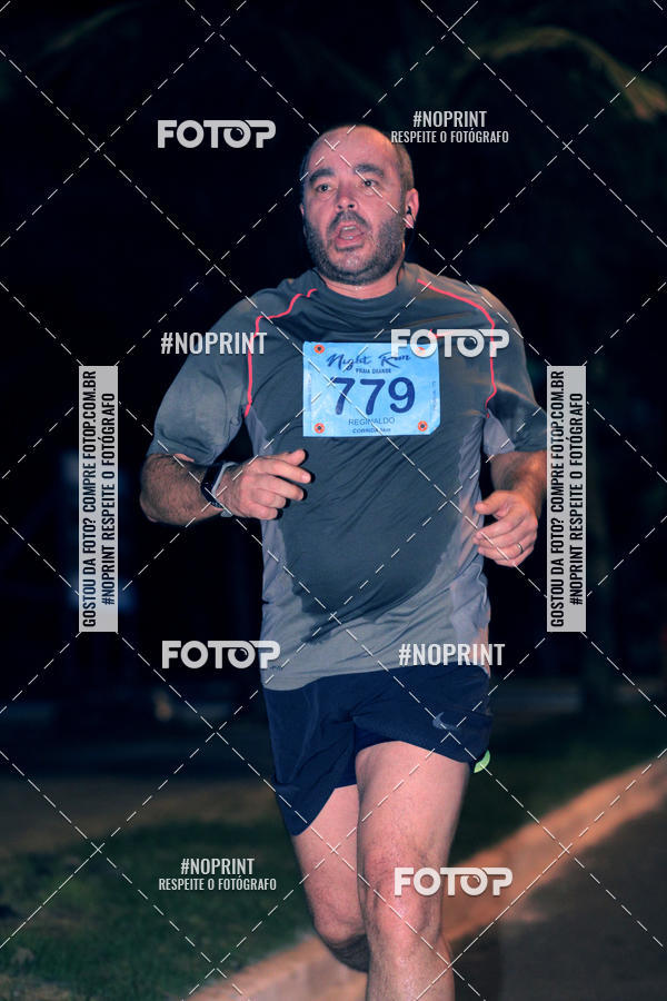 Buy your photos of the eventNight Run 5K 10K Praia Grande on Fotop