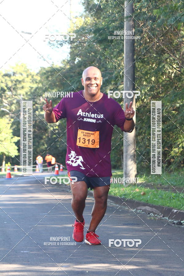 Compre suas fotos do eventoXIV Corrida UNICEP no Fotop