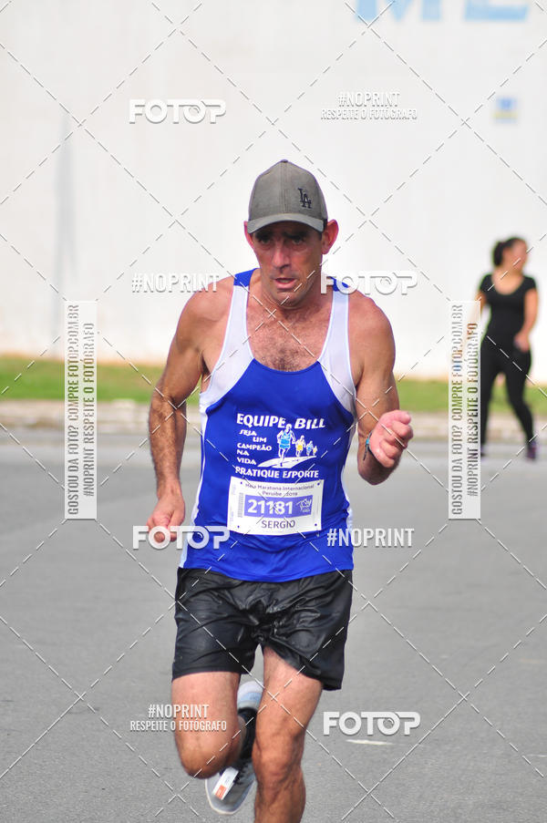 Compre suas fotos do eventoMeia Maratona Internacional de Peru�be no Fotop
