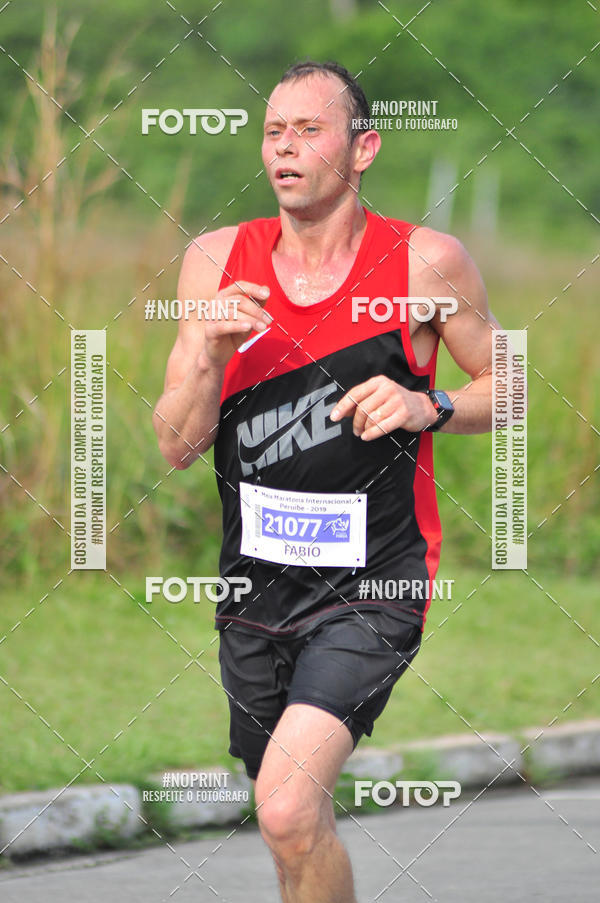 Compre suas fotos do eventoMeia Maratona Internacional de Peru�be no Fotop