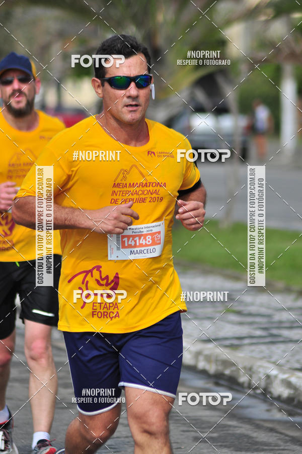 Compre suas fotos do eventoMeia Maratona Internacional de Peru�be no Fotop