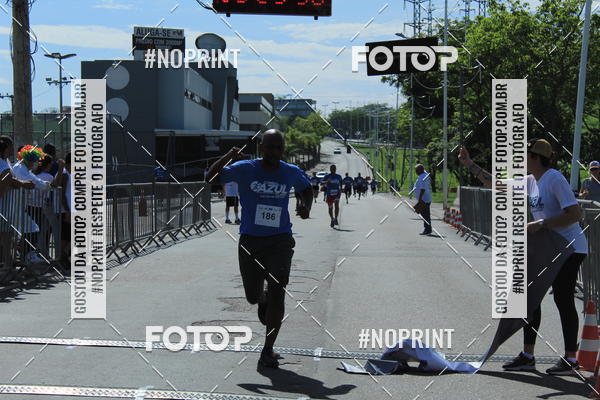 Compre as suas fotos do eventoCorrida e Caminhada Azul no Fotop