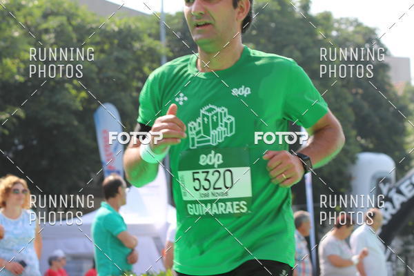 Buy your photos of the eventMeia Maratona Guimares on Fotop