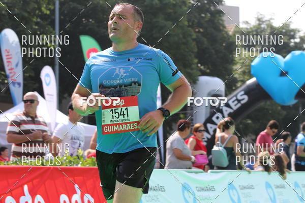 Buy your photos of the eventMeia Maratona Guimares on Fotop